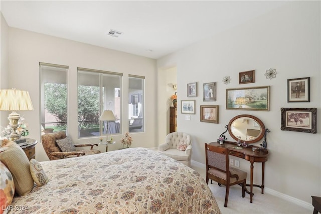 bedroom with light colored carpet