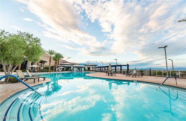 view of swimming pool featuring a patio area