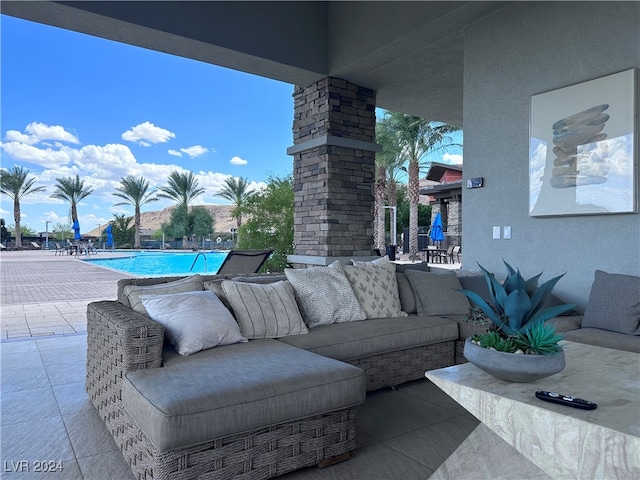 view of patio featuring an outdoor hangout area and a community pool