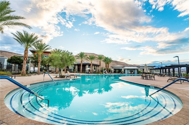 view of swimming pool with a patio