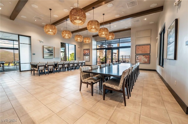 tiled dining room with beamed ceiling and a high ceiling