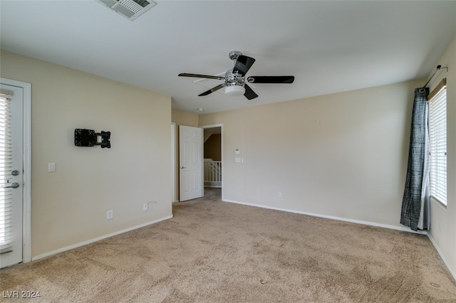 carpeted empty room with ceiling fan