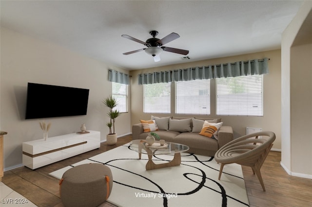 living room with ceiling fan and hardwood / wood-style flooring