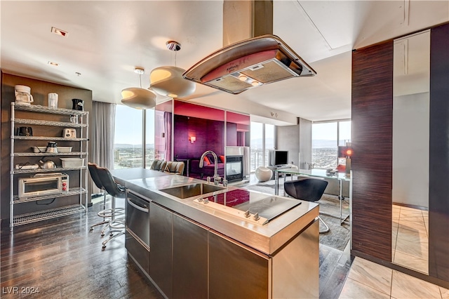 4381 W Flamingo Rd Unit 3021, Las Vegas, NV 89103 - kitchen featuring a sink, plenty of natural light, wood finished floors, and open floor plan