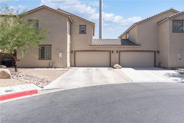 view of front of property with a garage