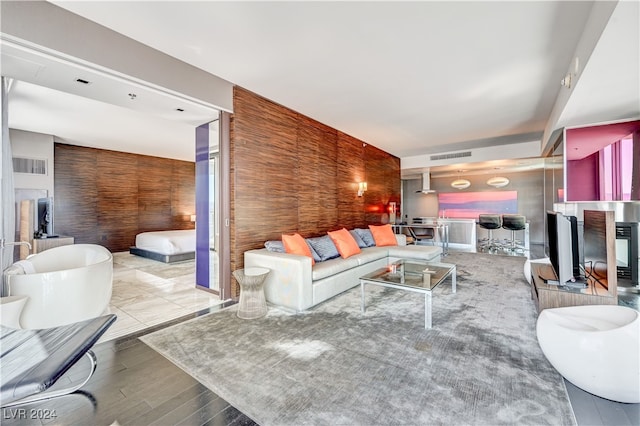 living room with visible vents and wood finished floors