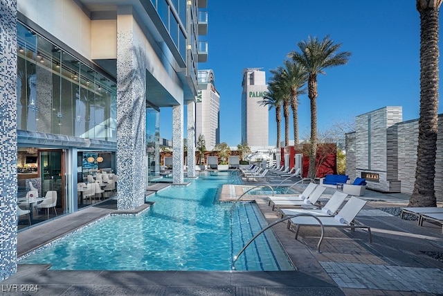 community pool with a patio area