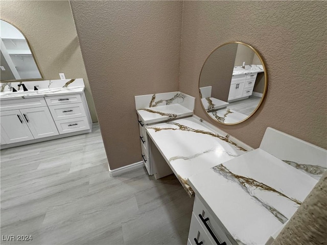 bathroom featuring hardwood / wood-style floors and vanity