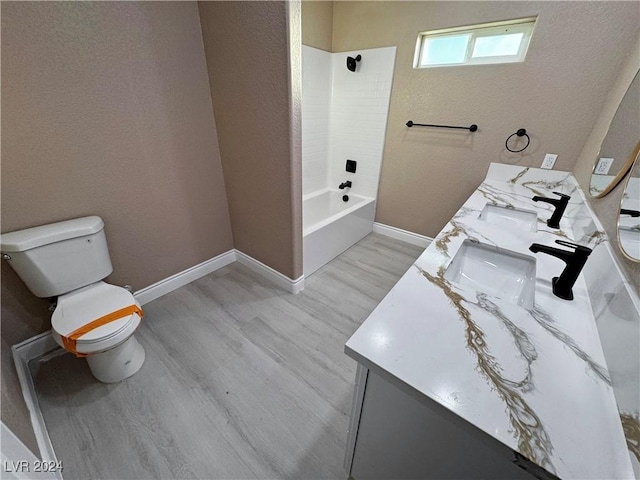 full bathroom featuring wood-type flooring, vanity, and toilet