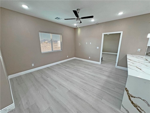 interior space featuring light hardwood / wood-style floors and ceiling fan