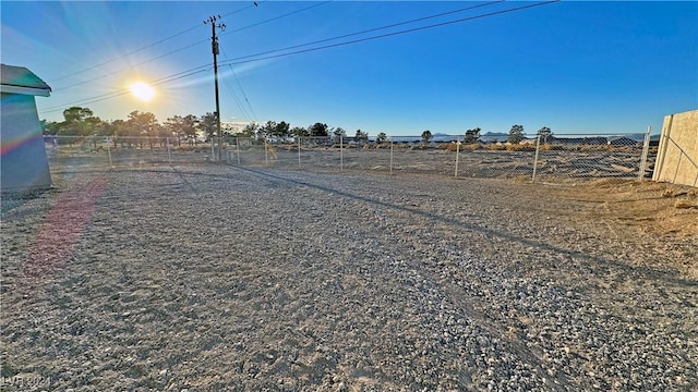 view of yard with a rural view