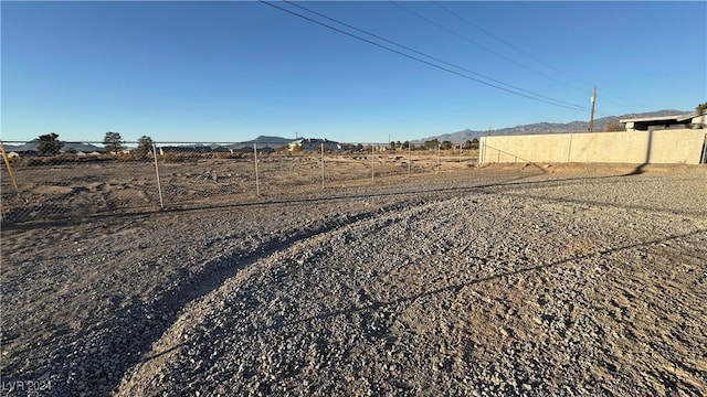 view of yard with a rural view