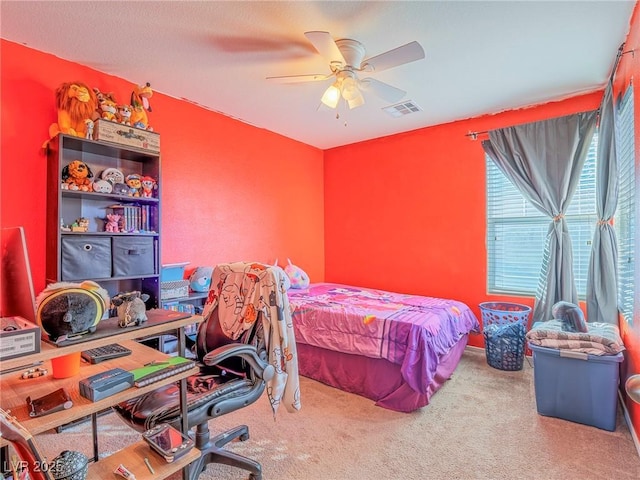 carpeted bedroom with ceiling fan