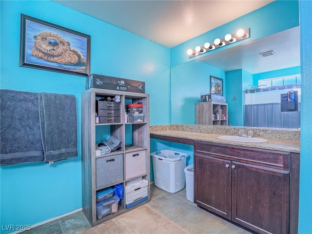 bathroom featuring vanity and walk in shower