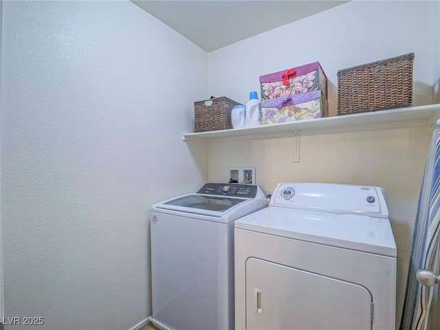 laundry area with separate washer and dryer