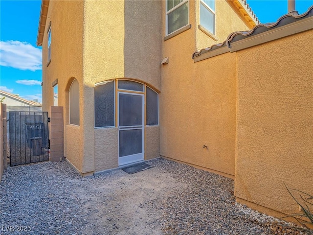 view of property exterior featuring a patio area