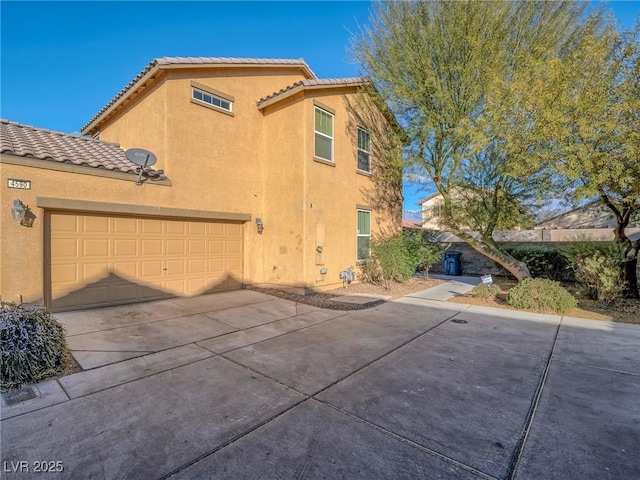 view of property exterior with a garage