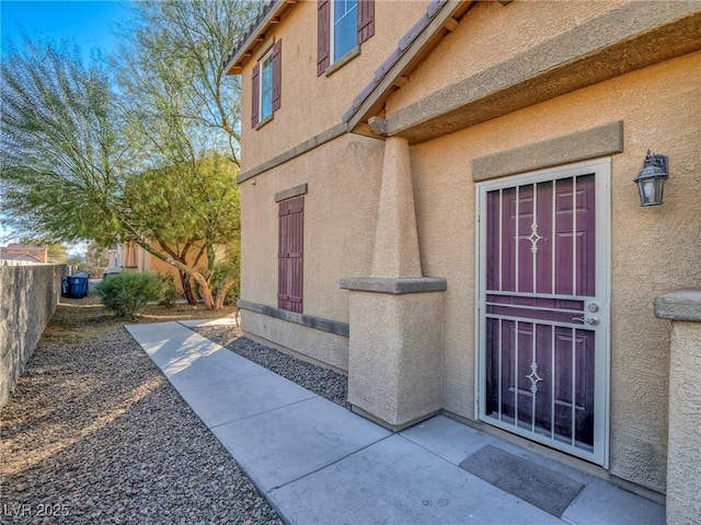 doorway to property with a patio area