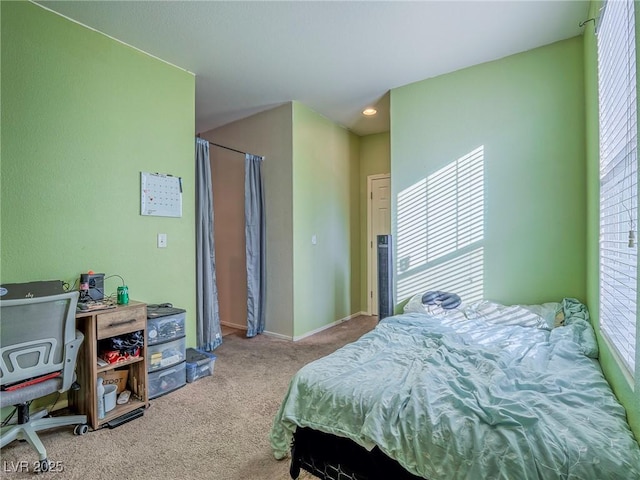 bedroom featuring light colored carpet