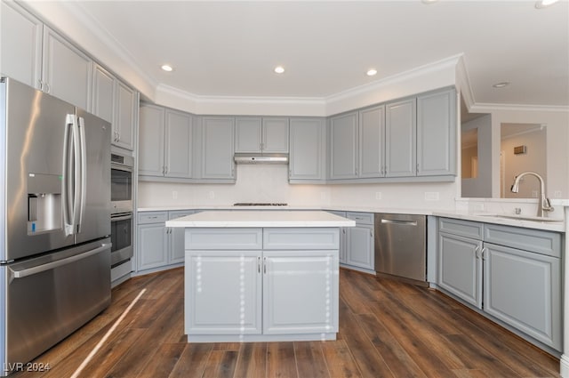 kitchen with a kitchen island, stainless steel appliances, gray cabinets, and sink