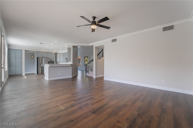 unfurnished living room featuring ceiling fan, ornamental molding, and dark wood-type flooring