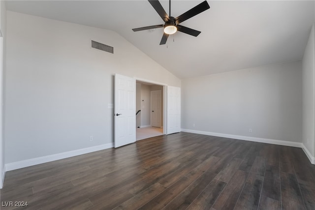 spare room with lofted ceiling, dark wood-type flooring, and ceiling fan