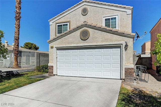 front of property featuring a garage