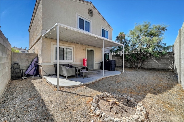 rear view of house featuring a patio