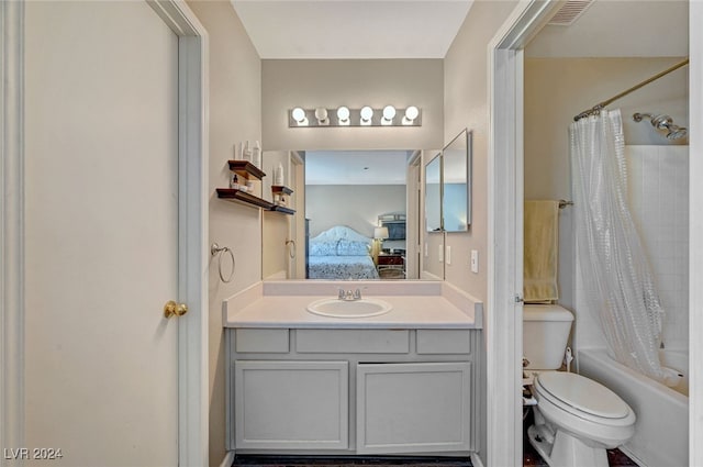 full bathroom with vanity, toilet, and shower / tub combo with curtain