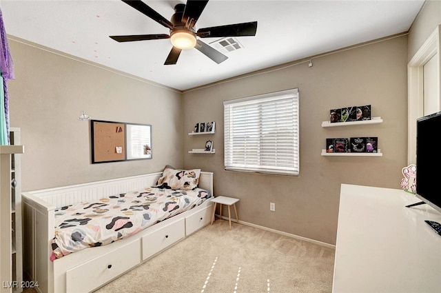 bedroom featuring ceiling fan, light colored carpet, and crown molding