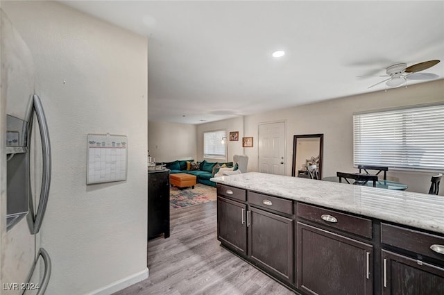 kitchen featuring plenty of natural light, light hardwood / wood-style flooring, ceiling fan, and dark brown cabinetry