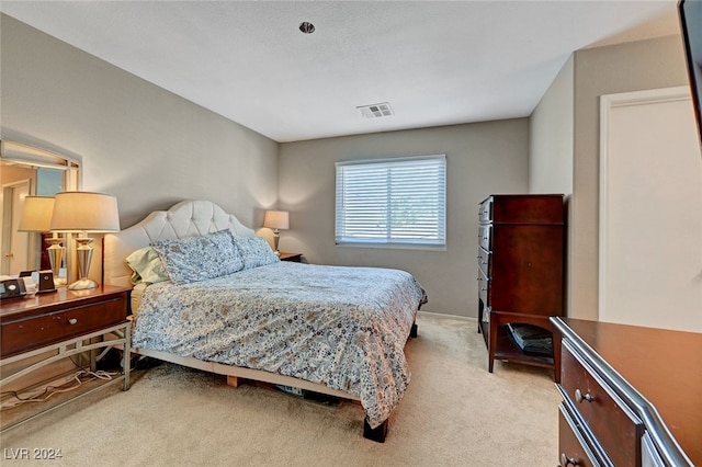 bedroom featuring light colored carpet