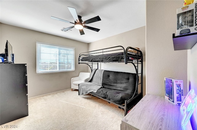 bedroom with ceiling fan and carpet