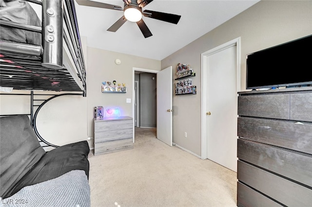 carpeted bedroom featuring ceiling fan