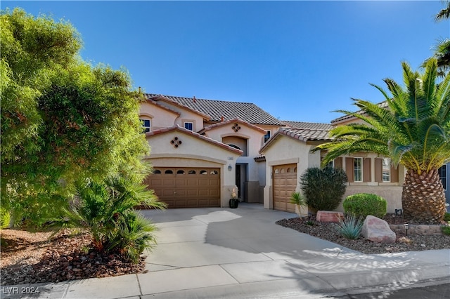 mediterranean / spanish-style home featuring a garage