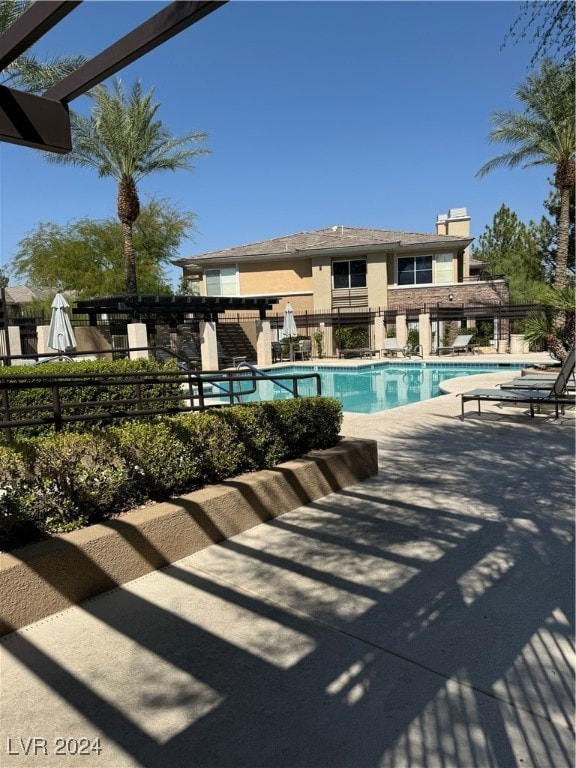 view of swimming pool with a patio