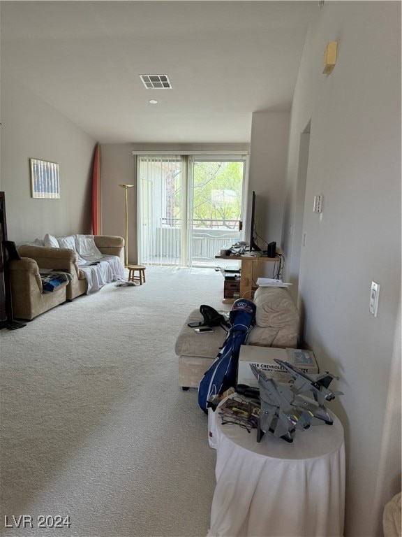 bedroom with carpet floors, vaulted ceiling, and access to exterior