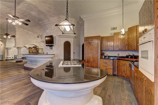 kitchen with ceiling fan, dark hardwood / wood-style floors, white oven, and high vaulted ceiling