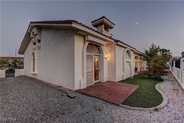 back of house with a patio area