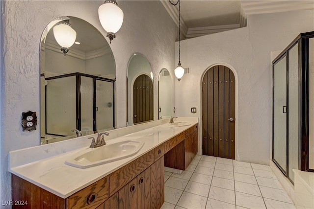 bathroom with ornamental molding, vanity, walk in shower, and tile patterned flooring