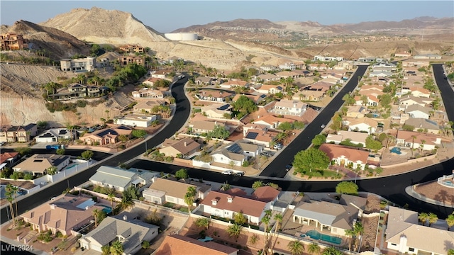 birds eye view of property with a mountain view