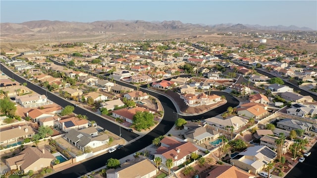 birds eye view of property featuring a mountain view