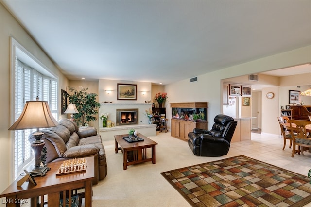 living room with a wealth of natural light and light colored carpet