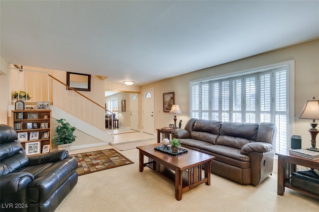 living room with plenty of natural light and carpet floors