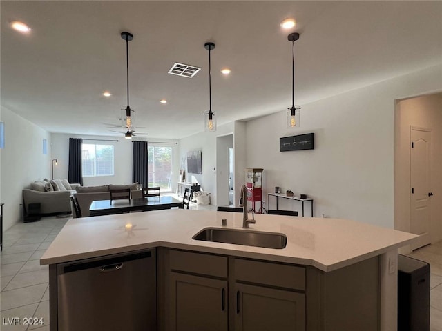 kitchen featuring an island with sink, gray cabinets, ceiling fan, stainless steel dishwasher, and sink