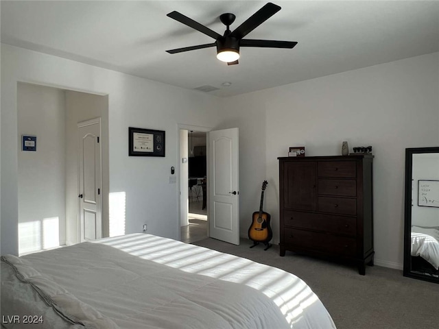 carpeted bedroom featuring ceiling fan