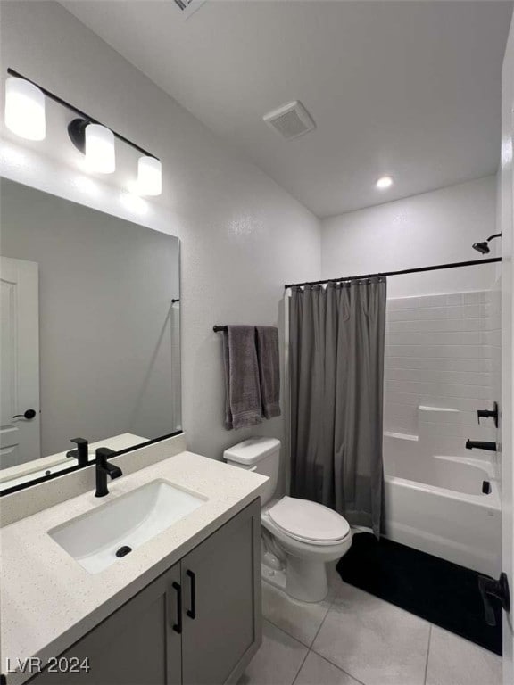 full bathroom featuring vanity, tile patterned flooring, toilet, and shower / tub combo with curtain