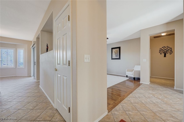 hallway with light wood-type flooring