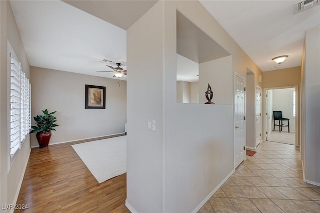 hall with light hardwood / wood-style floors