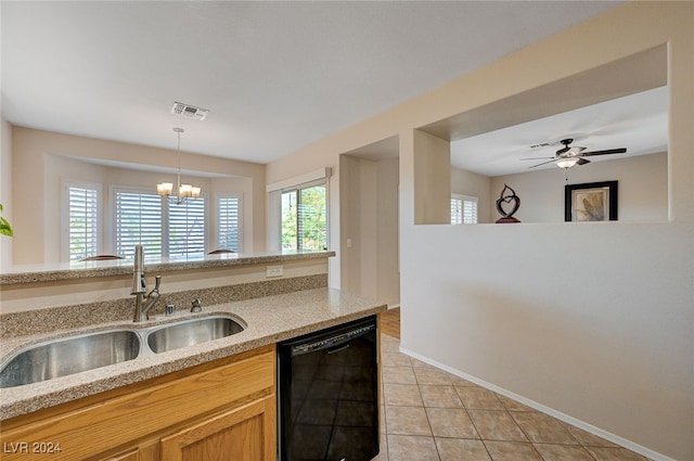 kitchen with dishwasher, ceiling fan with notable chandelier, sink, light tile patterned floors, and decorative light fixtures